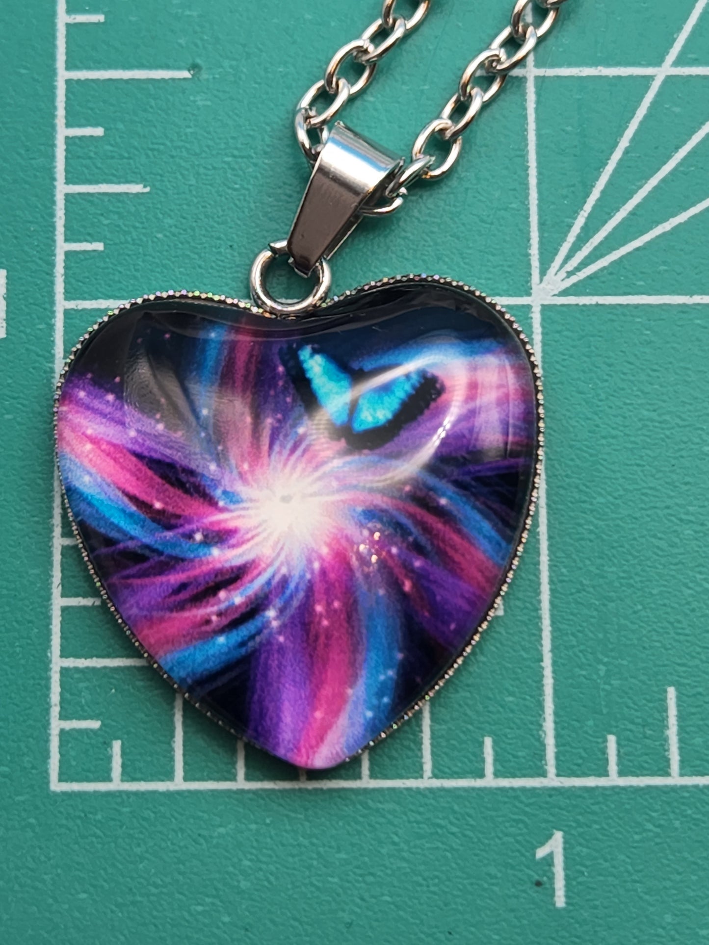 Blue and Mauve Swirl Butterfly Pattern with Heart Shape Glass 1" Necklace